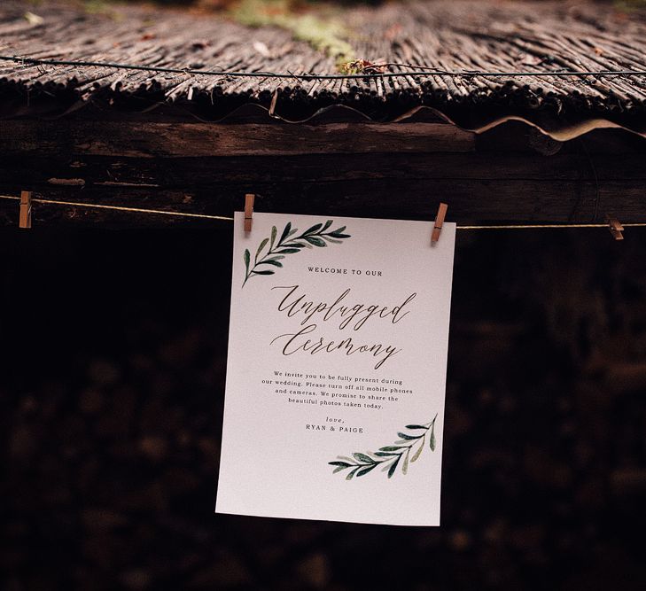 Unplugged Ceremony Sign | Outdoor Wedding Ceremony at Il Rigo Agriturismo, Tuscany | Rue de Seine Wedding Dress with Pronovias Overskirt, Personalised Place Setting Illustrations and Sweetheart Table | Samuel Docker Photography