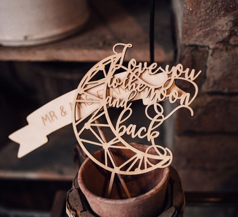 Wooden Photobooth Props | Wedding Reception at Il Rigo Agriturismo, Tuscany | Rue de Seine Wedding Dress with Pronovias Overskirt, Personalised Place Setting Illustrations and Sweetheart Table | Samuel Docker Photography