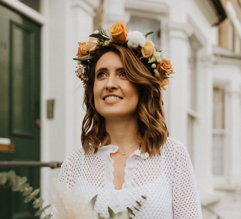 Bride wearing  roses and cotton flower floral crown teamed with vintage dress