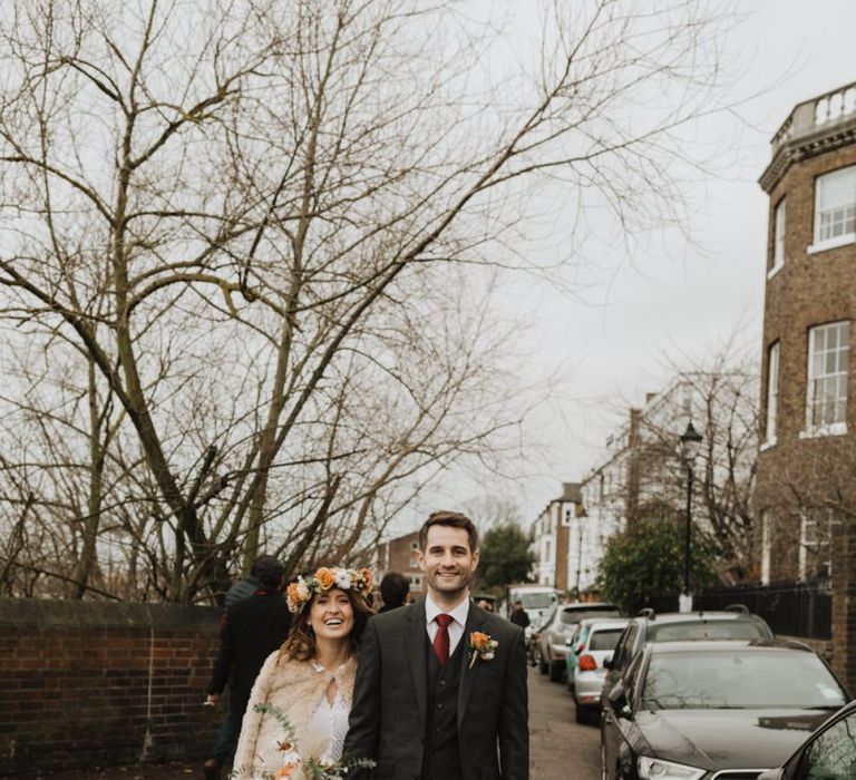 Winter wedding at Linden House in London with bride wearing beautiful floral crown and Groom in three piece suit