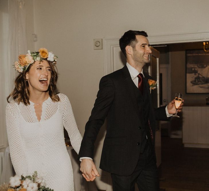 Bride and groom at Linden House for intimate wedding with modern boho styling  and floral crown