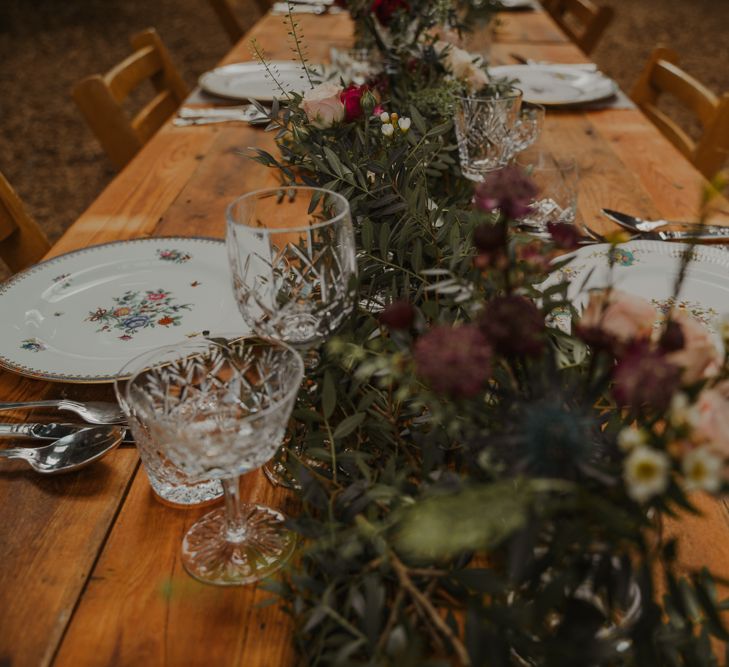 Rustic Tablescape with Floral Runner and Vintage Tableware