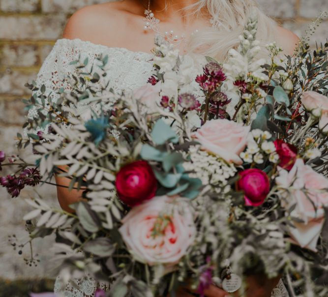 Boho bride with Pink and Red Flower Crown and Wedding Bouquet