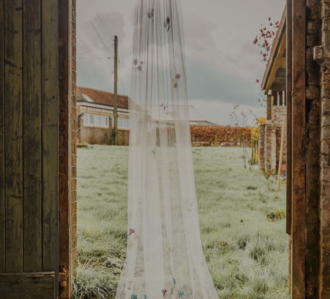 Floral Anne-Marie Prescott Handmade Wedding Veil in Barn Doorway