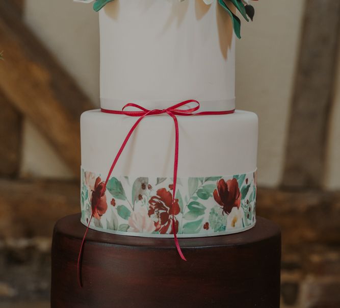 Three Tier Wedding Cake with Chocolate Layer , Painted Flower Trim and  Floral Cake Topper