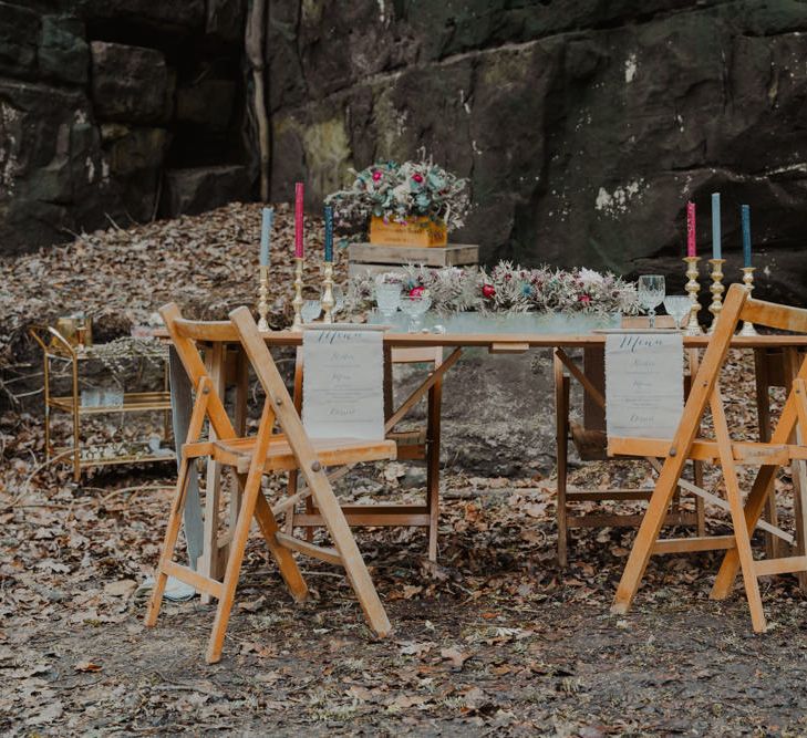 Rustic Tablescape with Candlesticks and Tapper Candles and Fabric Menu Cloths