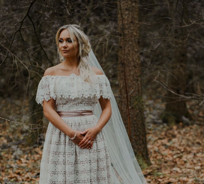 Bride in Lace Wedding Dress with Pink Ribbon Belt