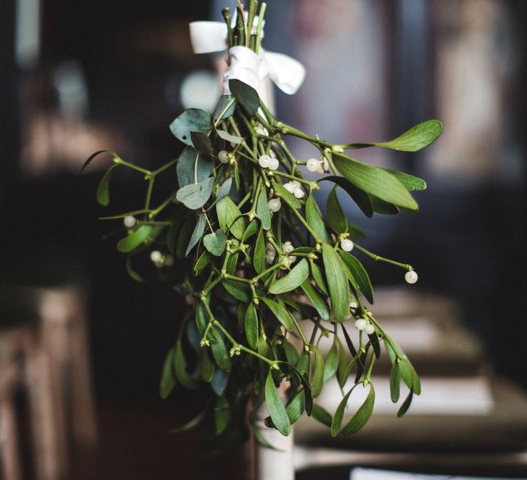 Hanging Mistletoe on Wedding Aisle Ends