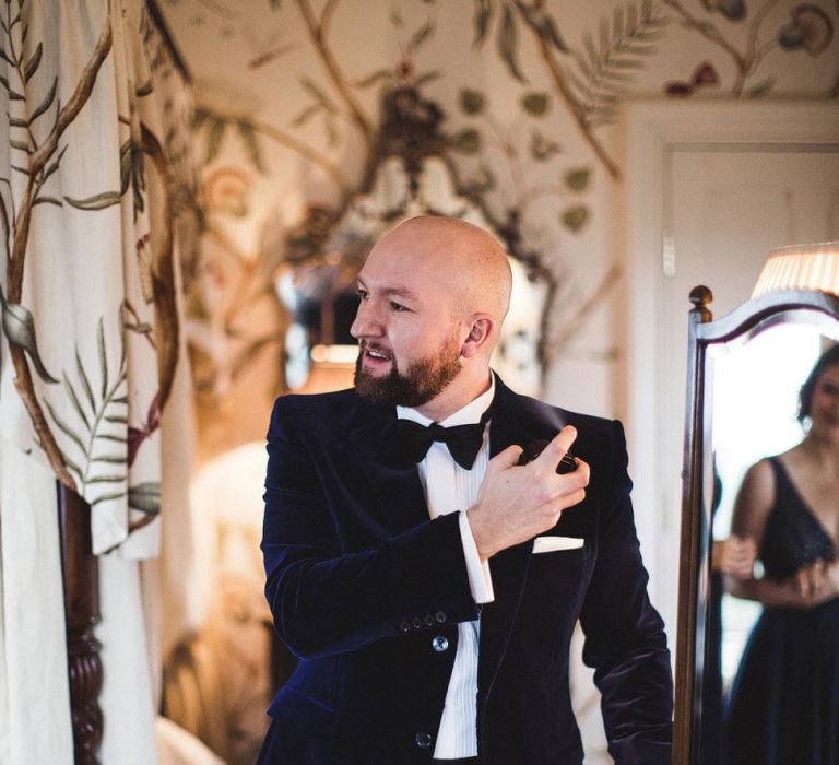 Groom Getting Ready in Black Suit &amp; Bow Tie