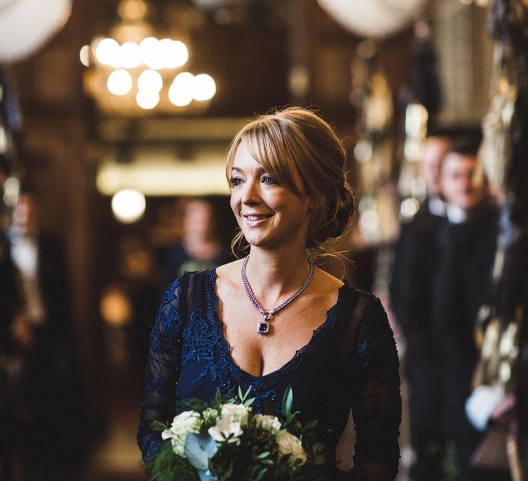 Bridesmaid in Navy Dress Walking Down The Aisle