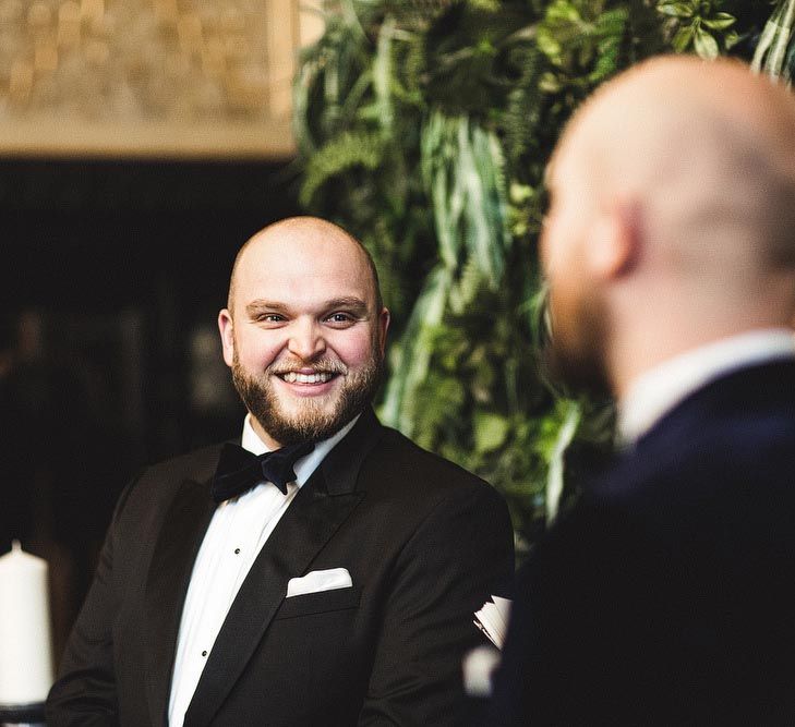 Groom Smiling at his Groom During The Wedding Ceremony