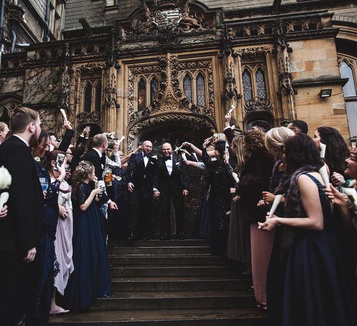 Groom &amp; Groom Walking Down Carlton Towers Steps During Confetti Moment