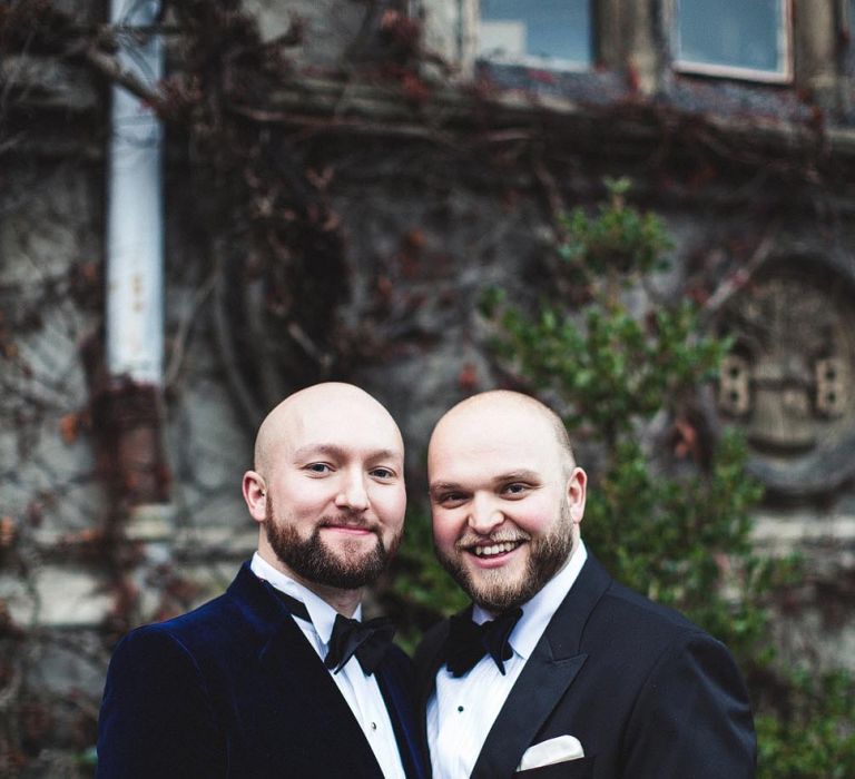 Groom and Groom in Black Tie Wedding Suits