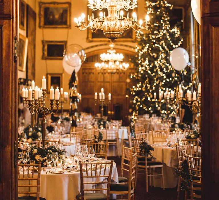 Christmas Wedding Reception Decor with Christmas Tree and Candelabra Centrepieces