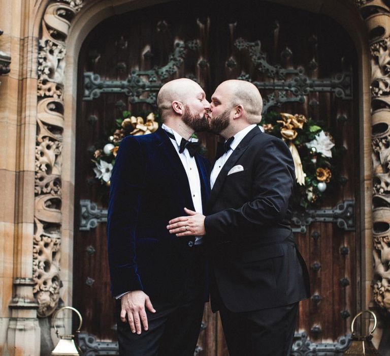 Groom and Groom Kissing in Black Tuxedo's