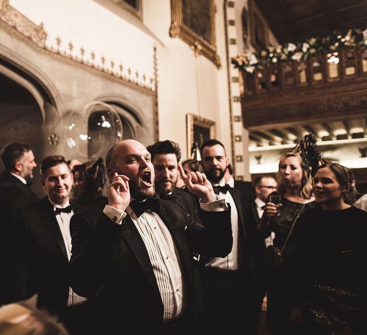 Groom Singing Christmas Carols During Winter Wedding