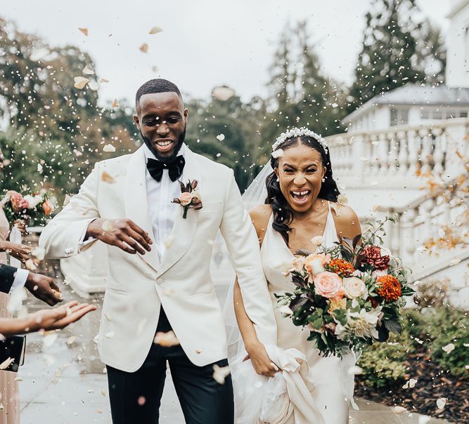 Confetti moment at Coworth Park black tie wedding