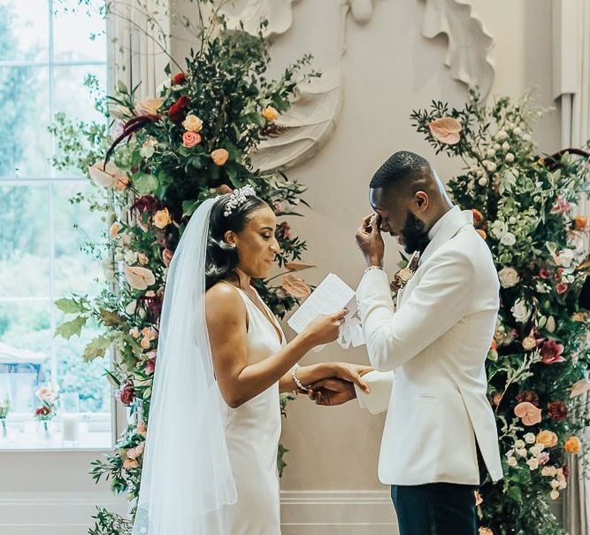 Emotional groom during the wedding ceremony at Coworth Park