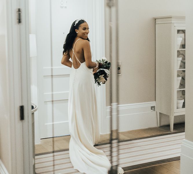 Bride in minimalist slip wedding dress from ASOS