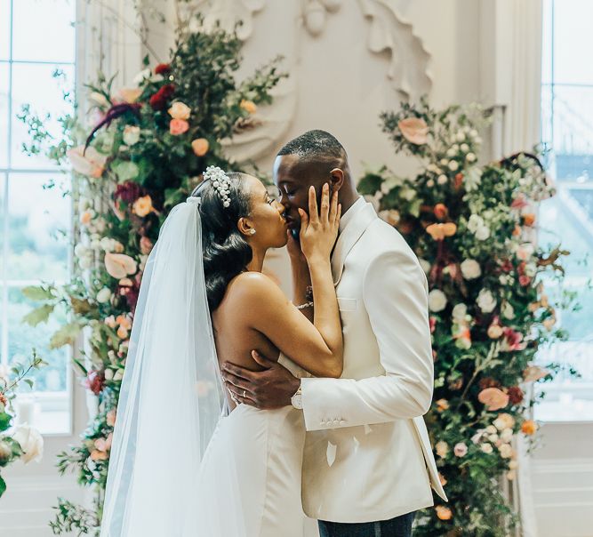 You may now kiss the bride moment at Coworth Park by Rebecca Carpenter Photography