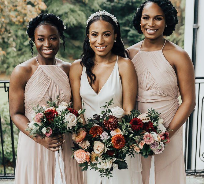 Bridesmaid picture with bridesmaids in pink dresses at Coworth Park