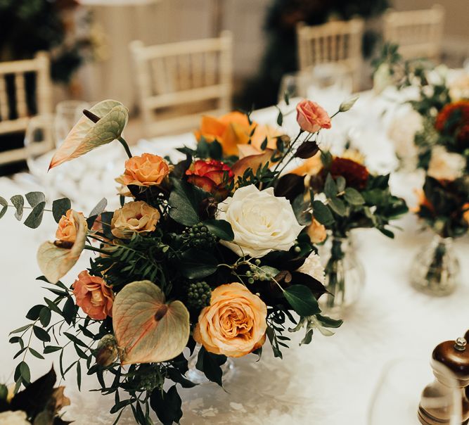 Autumn wedding flowers with roses, anthuriums and foliage