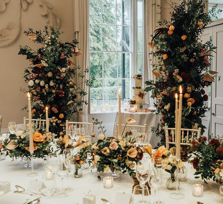 Wedding reception table flowers and decor at Coworth Park