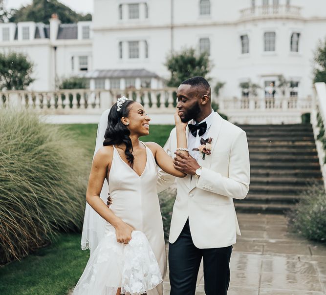 Stylish bride and groom portrait by Rebecca Carpenter Photography at Coworth Park