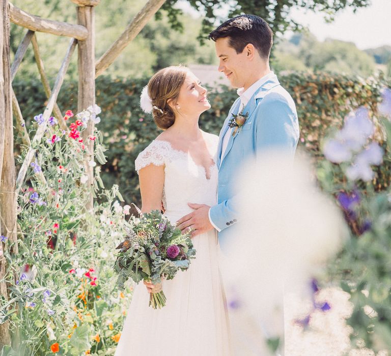 Bride in Lace Wedding Dress with Back Detail | Groom in Pale Blue Jacket &amp; Chino's | Pastel Peter Rabbit Spring Inspiration at River Cottage | Beatrix Potter | Mr McGregor's Garden | Jennifer Jane Photography