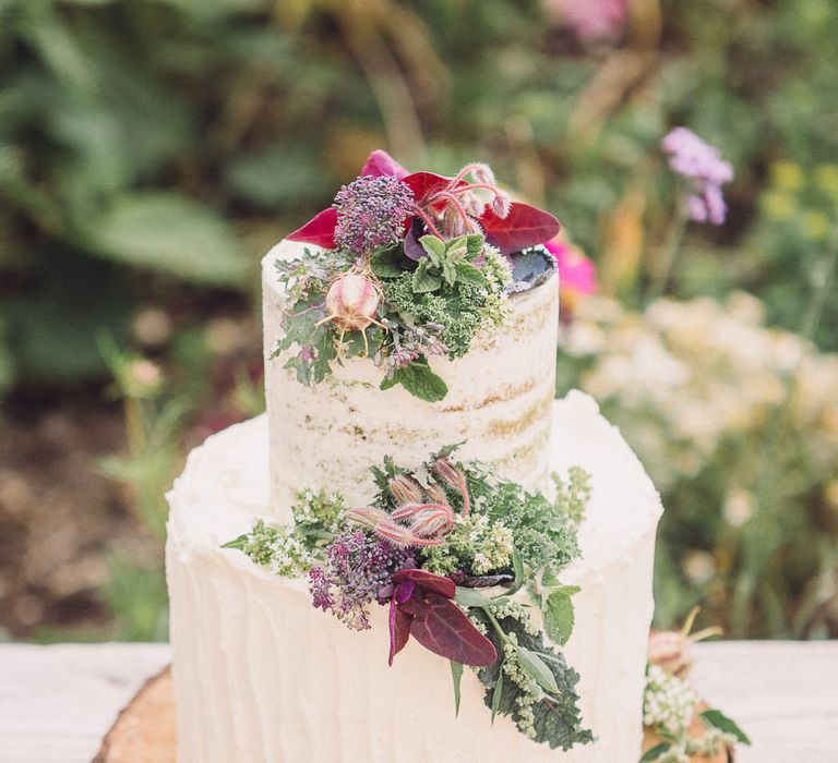 Two Tier Ice Wedding Cake with Flower Decor on a Tree Slice by Clare Makes Cakes | Whimsical De Winton Paper Co. Wedding Stationery Suite | Pastel Peter Rabbit Spring Inspiration at River Cottage | Beatrix Potter | Mr McGreagor's Garden | Succulent Vegetables &amp; Flowers | Jennifer Jane Photography