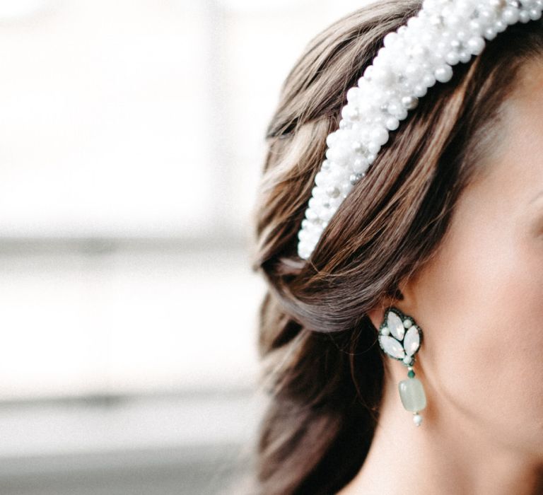 Brides delicate earrings and embellished headband