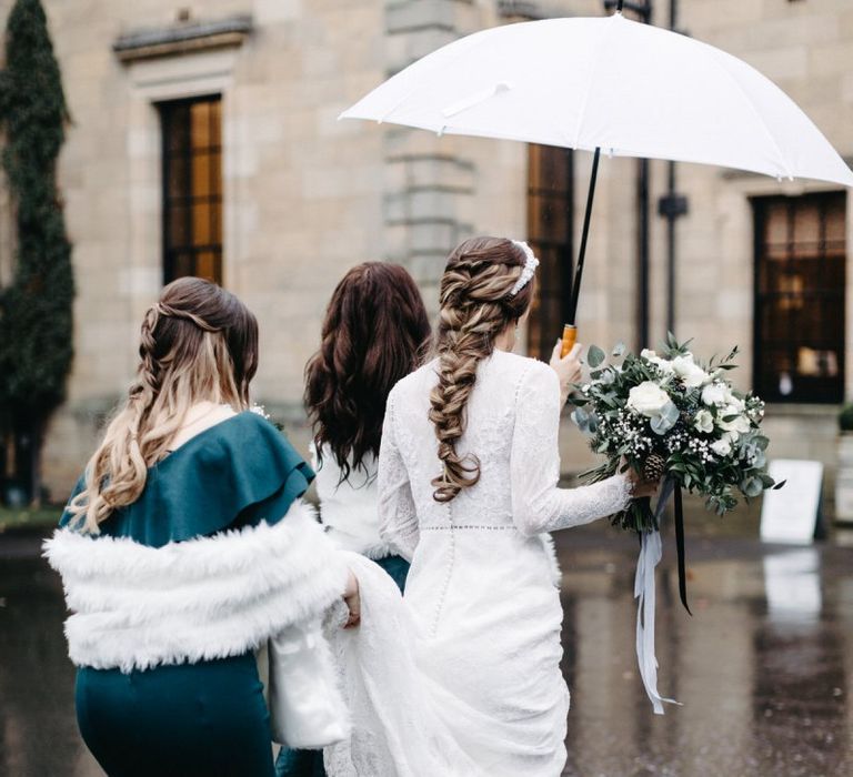 Bridal braid and bridesmaids wearing green dresses