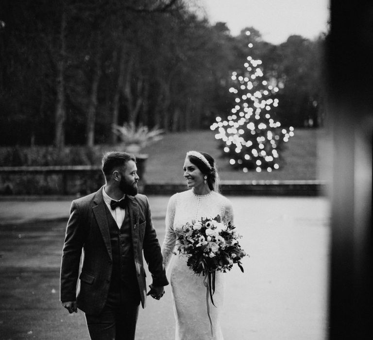 Bride and groom tie the knot at winter celebration with tweed wedding suit