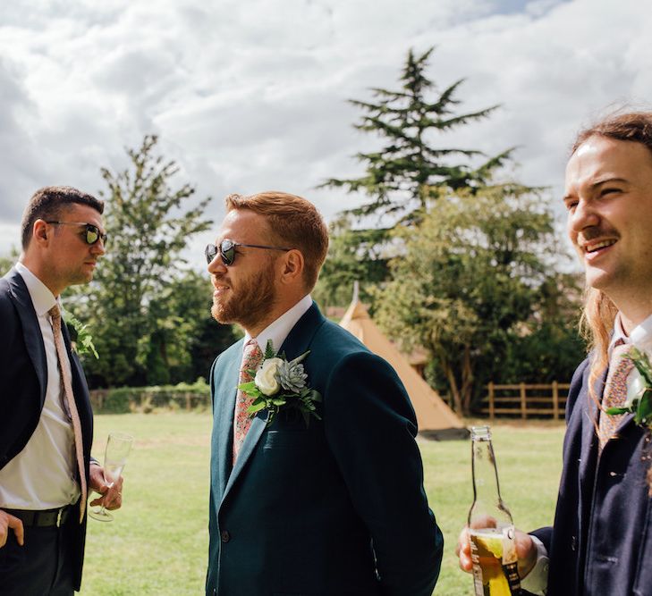 Groom in Paul Smith Suit &amp; Liberty Print Tie | Outdoor Wedding Ceremony &amp; Tipi Reception Planned by Benessamy Events | Red on Blonde Photography