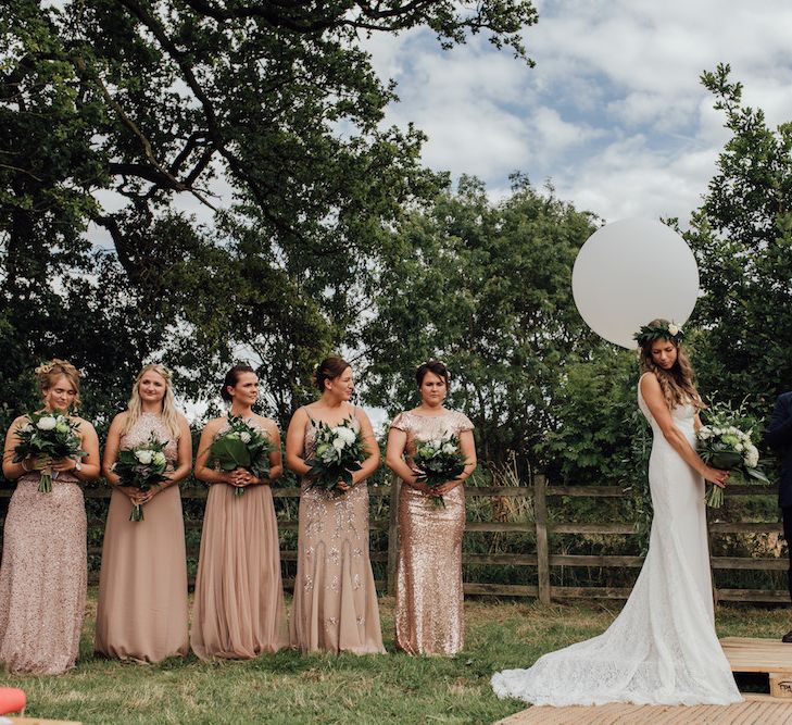 Bridesmaids in Blush Sequin Dresses | Bride in La Sposa Gown from Mirror Mirror Bridal | Groom in Paul Smith Suit | Outdoor Wedding Ceremony &amp; Tipi Reception Planned by Benessamy Events | Red on Blonde Photography