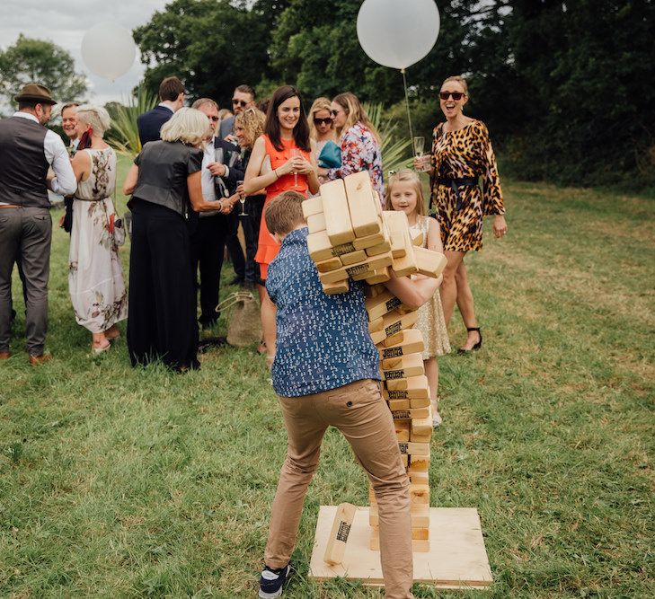 Giant Jenga Bridal Games | Outdoor Wedding Ceremony &amp; Tipi Reception Planned by Benessamy Events | Red on Blonde Photography