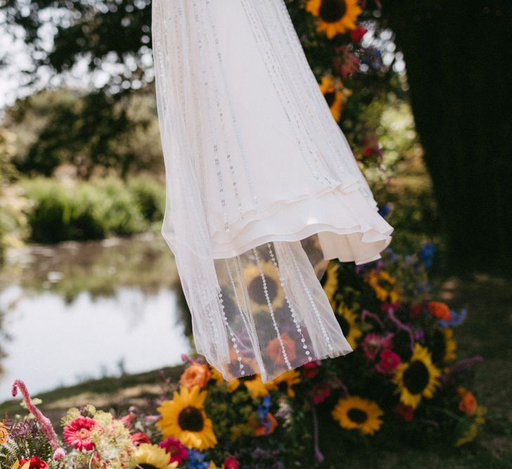 Jenny Packham Portia Wedding Dress Hanging Up in Sunflower Moon Gate