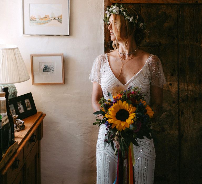 Bride in Jenny Packham Portia Wedding Dress Holding a Sunflower Wedding Bouquet