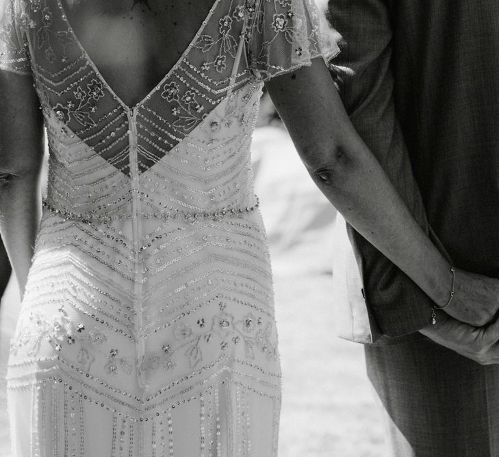 Bride in Jenny Packham Portia Wedding Dress and Groom Holding Hands