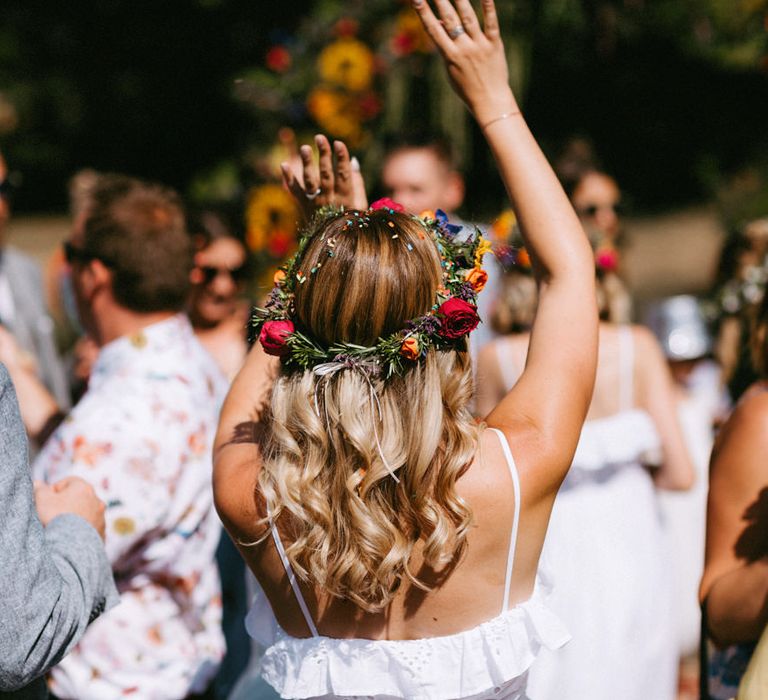 Bridesmaid with Wavy Hair, White Dress and Colourful Flower Crown