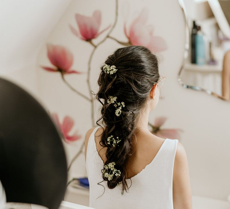 Bridal braid with flowers in her hair