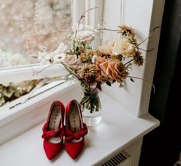 Red suede wedding shoes with bows