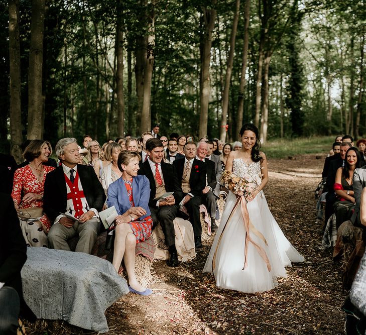 Woodland wedding ceremony bridal entrance in Valentini wedding dress