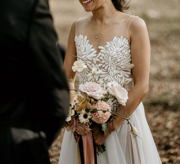 Bride in Valentini wedding dress with illusion neck line