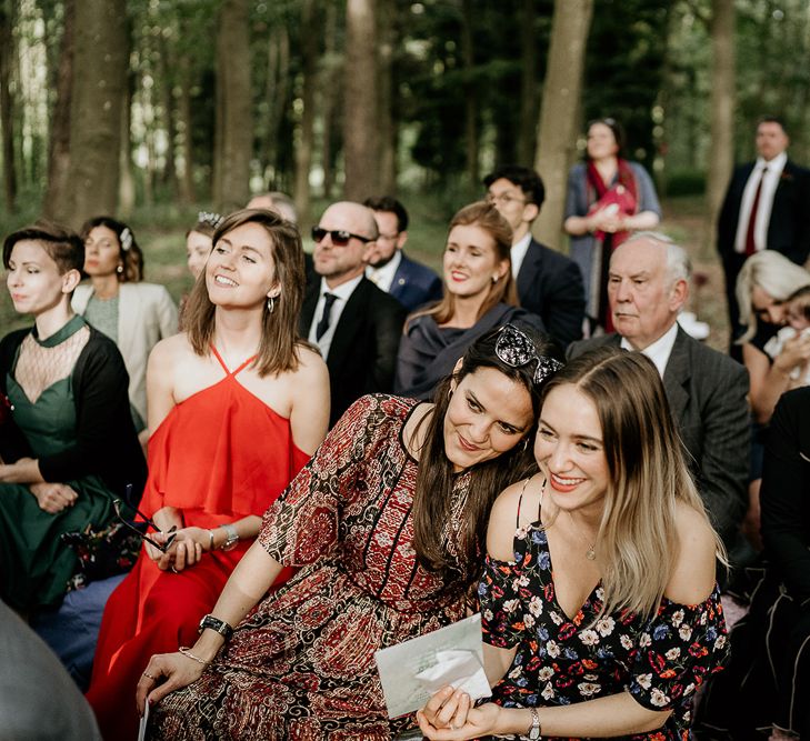 Wedding guests at outdoor Evenley Wood Garden wedding ceremony