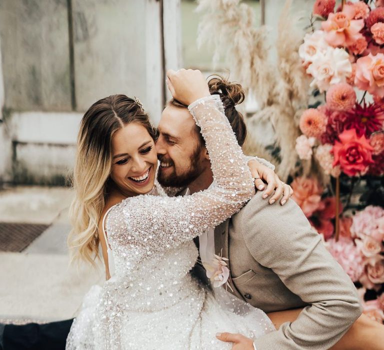 Fun bride and groom portrait for pink colour scheme wedding inspiration