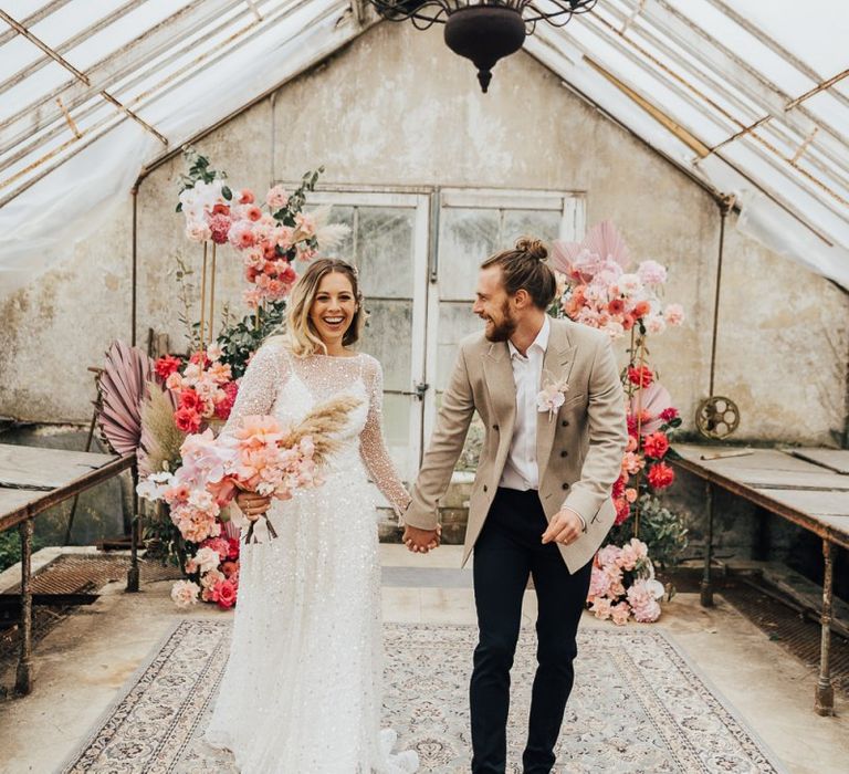 Conservatory with pink colour scheme decor and flowers