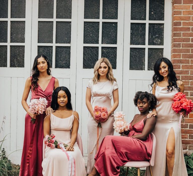 Bridesmaids in pink satin dresses by Constellation Âme