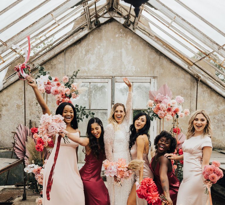 Fun bridal party portrait by Rebecca Carpenter Photography for intimate wedding with pink colour scheme