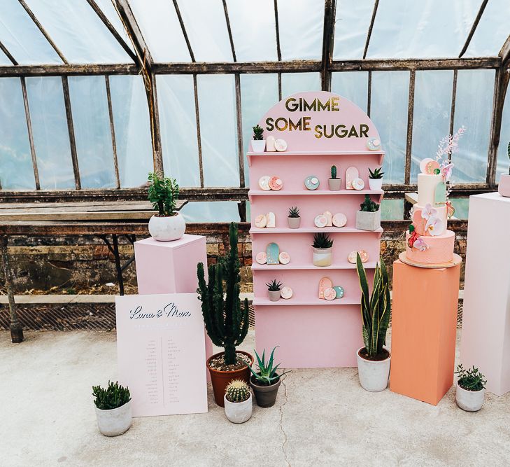 Wedding cake and biscuit display in a conservatory